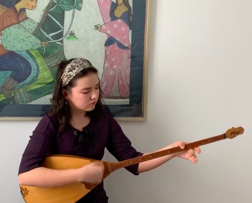 girl playing the dombra